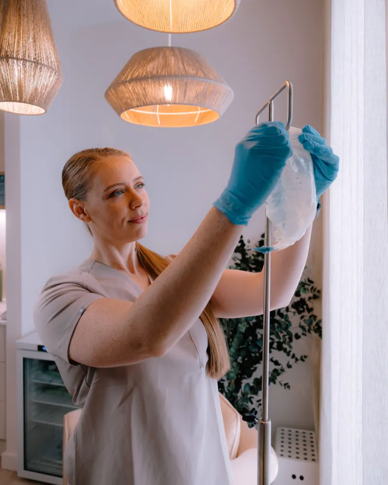 Clinician preparing an IV infusion